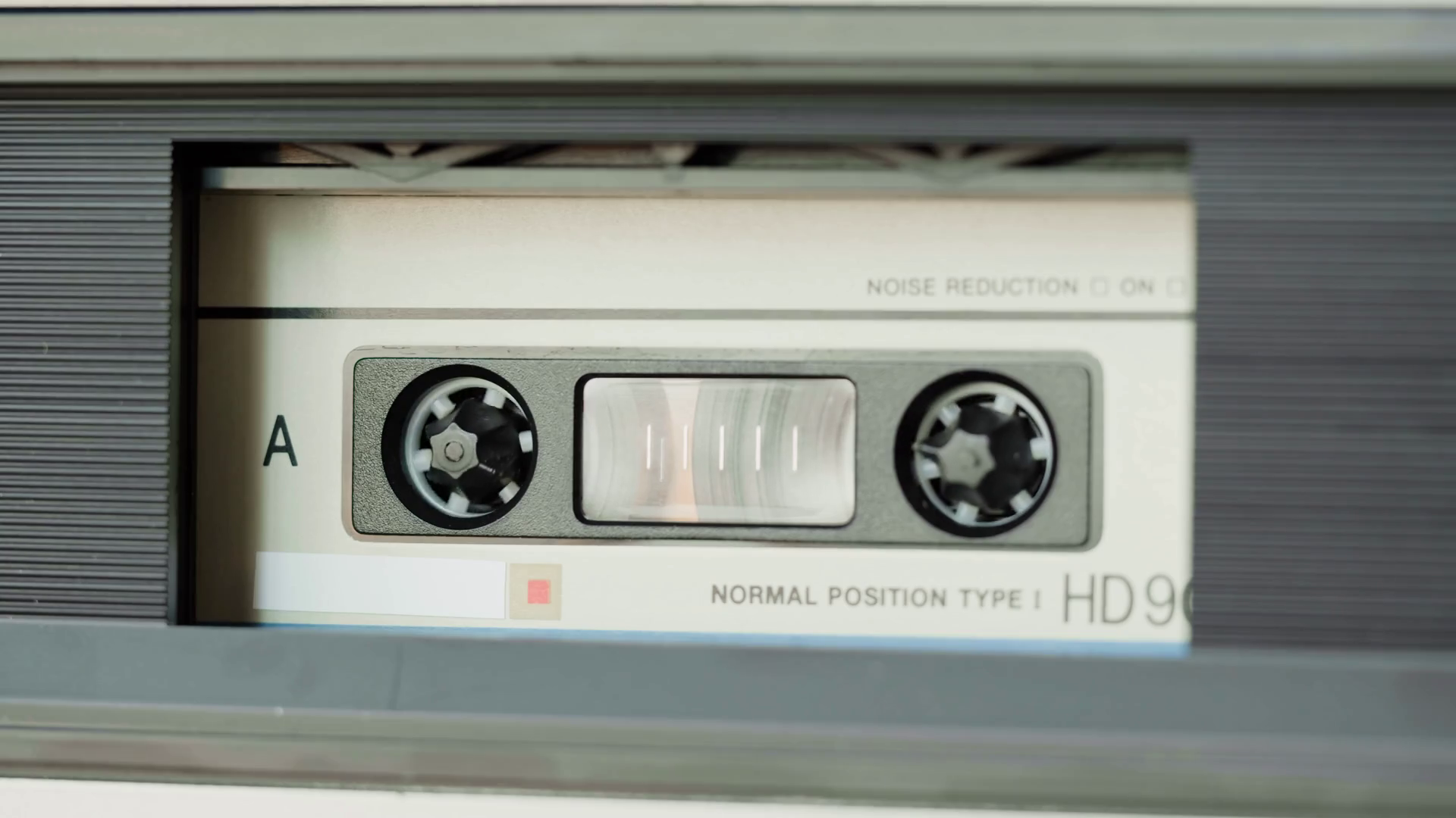 Retro radio tape recorder, audio cassette closeup. Listening to music