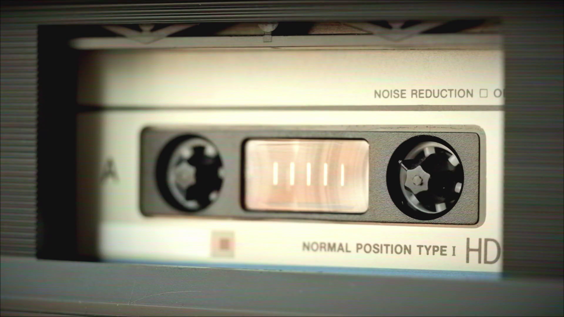 Retro radio tape recorder, audio cassette closeup. Listening to music