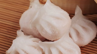 Various of frozen dim sum close-up macro. Food to take away. Chinese dessert food. Dimsum with shrimps, fish and meat. Dish in a cafe