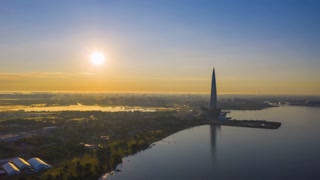 SAINT-PETERSBURG, RUSSIA - JUNE 23, 2019: Lakhta Center Skyscraper at Sunrise. Aerial Hyper Lapse, Time Lapse. Drone Flies Sideways and Upwards