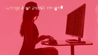 A woman working on a computer overlayed code and data
