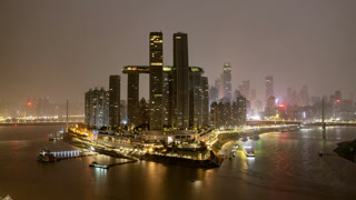 Chongqing cyberpunk skyline and yangtze river illuminated in leds at night in timelapse