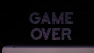 green game over words from retro computer arcade game