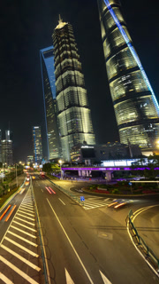 Timelapse of Shanghai city street scene with road traffic lit up at night in vertical