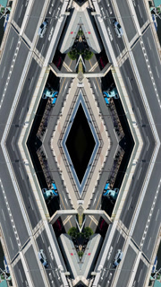 a mirrored shot of cars driving on motorway bridge in tokyo, japan in vertical