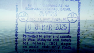 passport stamps and visas from different countries around the world overlayed on a calm blue sea