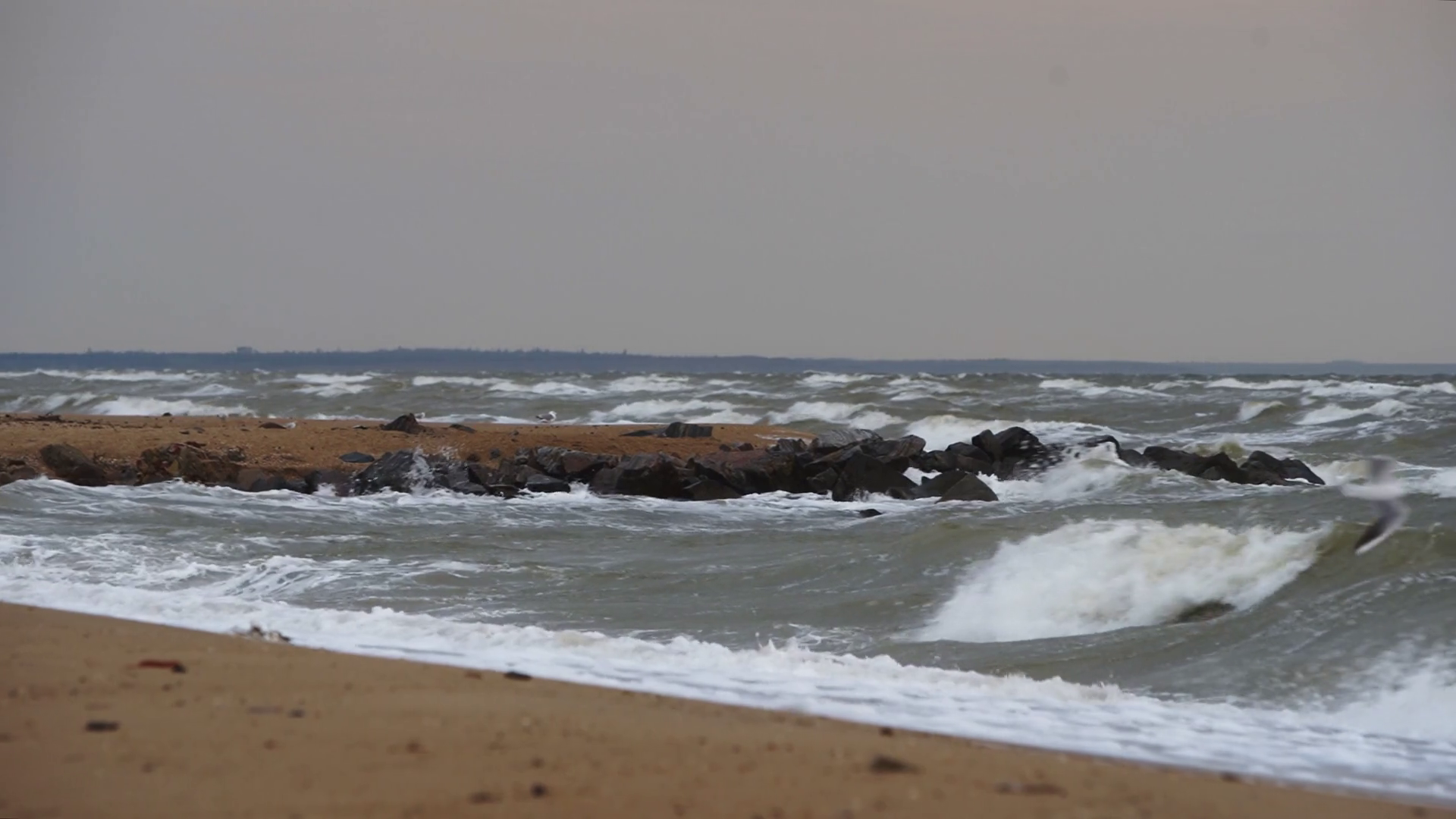 Choppy Sea Waves Crash Against Rocky Jetty Stock Footage SBV-348733047 ...