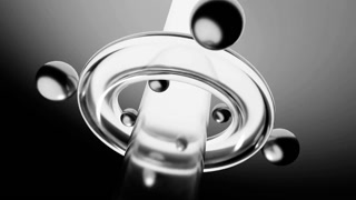 Metallic spheres rotating around a transparent cylinder emitting light. Design