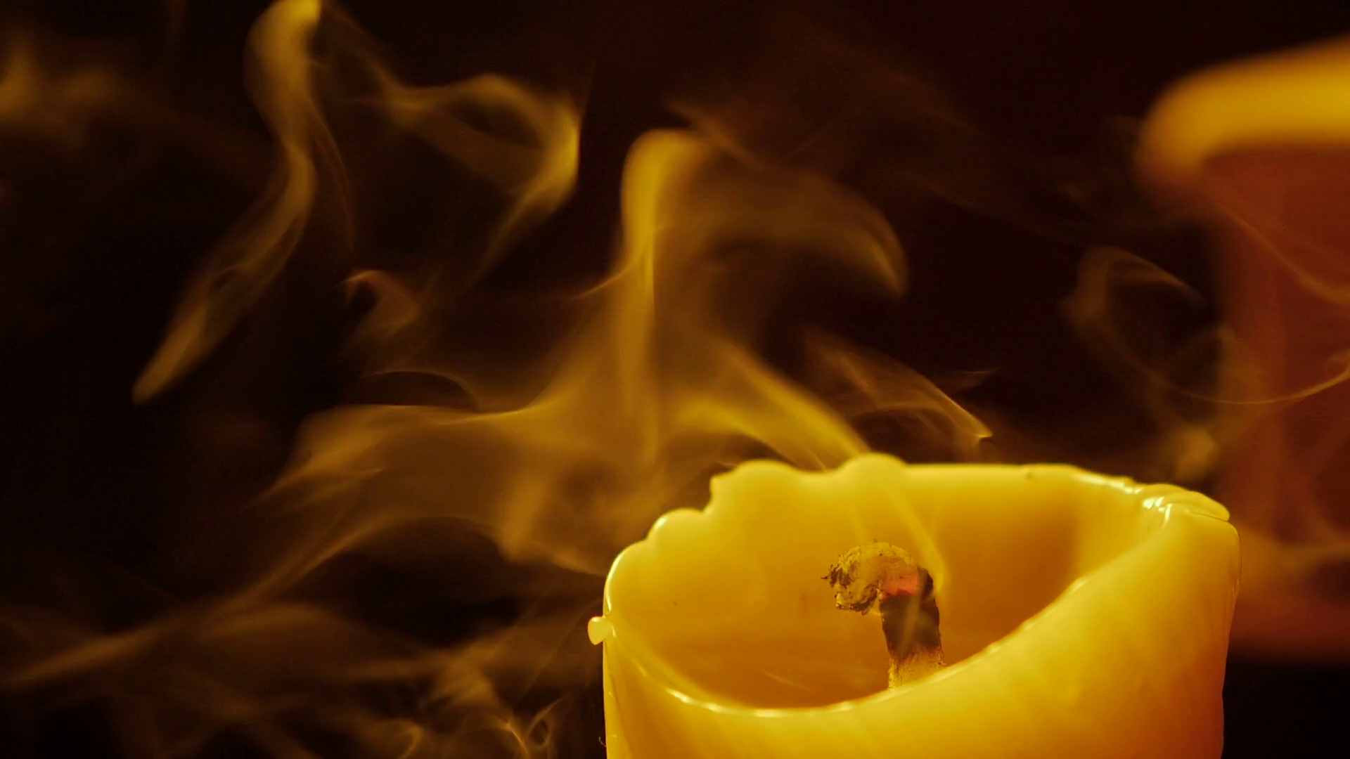 Books and candle. Fire and smoke. Light and blow out the candle. Slow