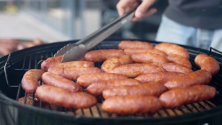 Grilling German sausages for Oktoberfest celebration