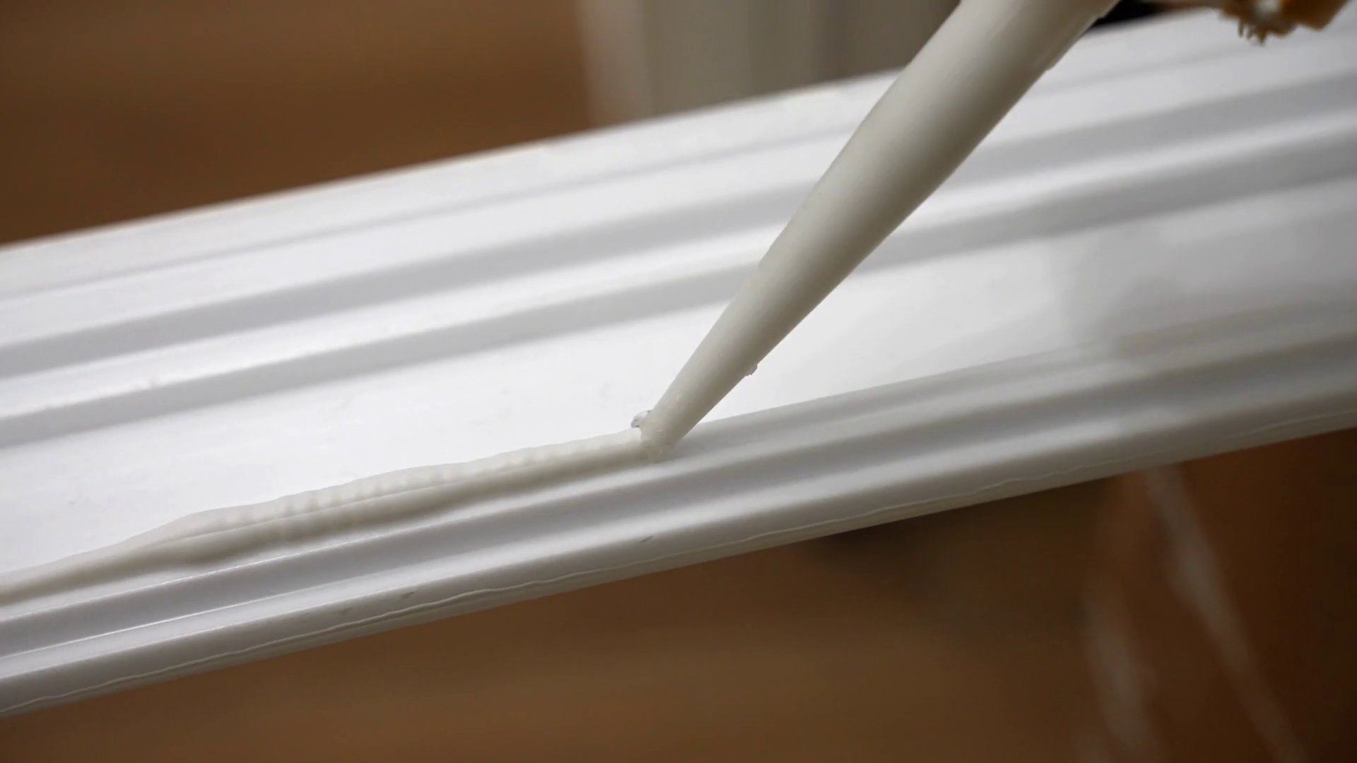 Process Of Applying Glue On White Baseboard Stock Footage SBV348525457