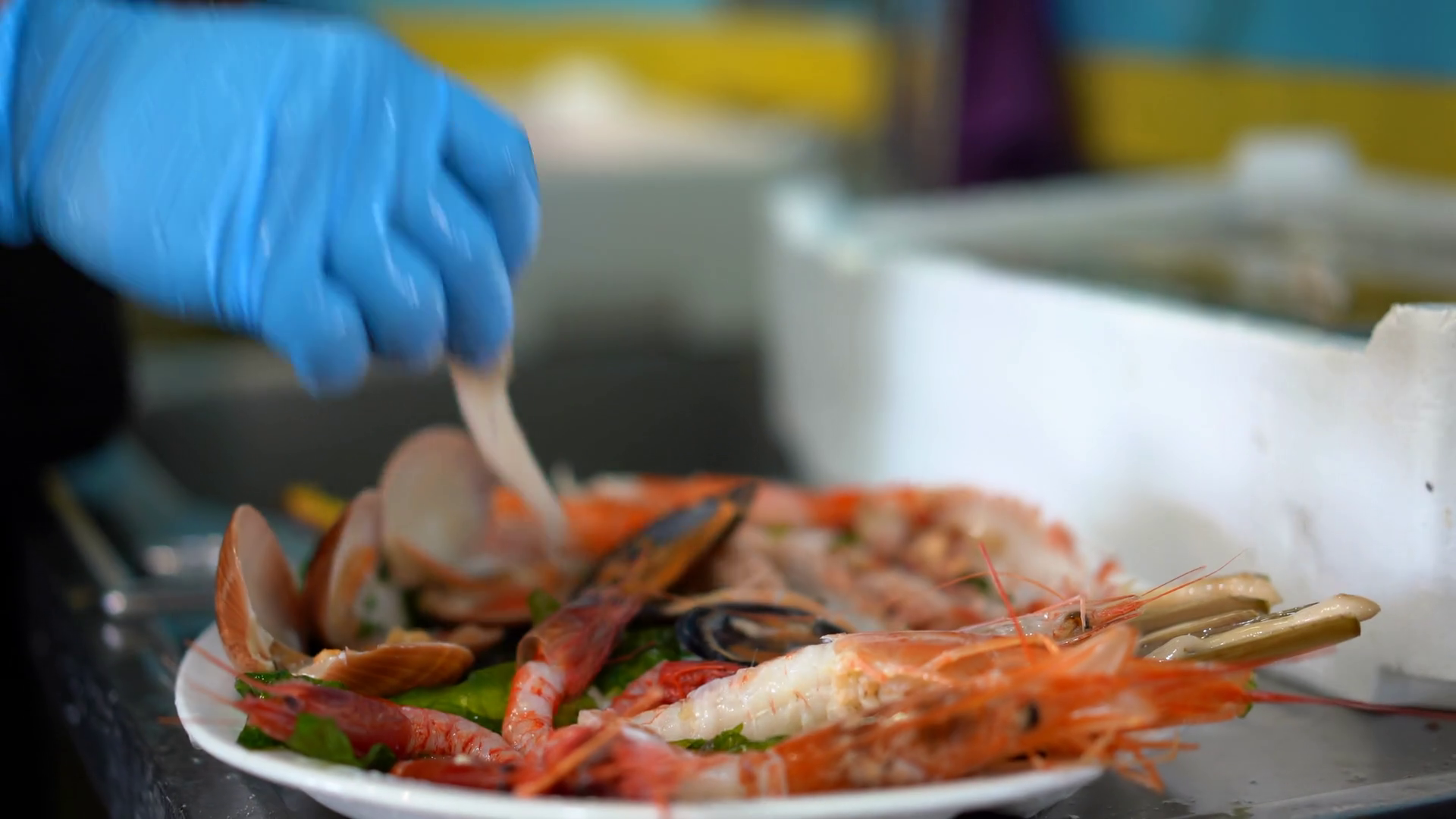 Cleaning Seafood with running water in restaurant`s sink. Shrimp and