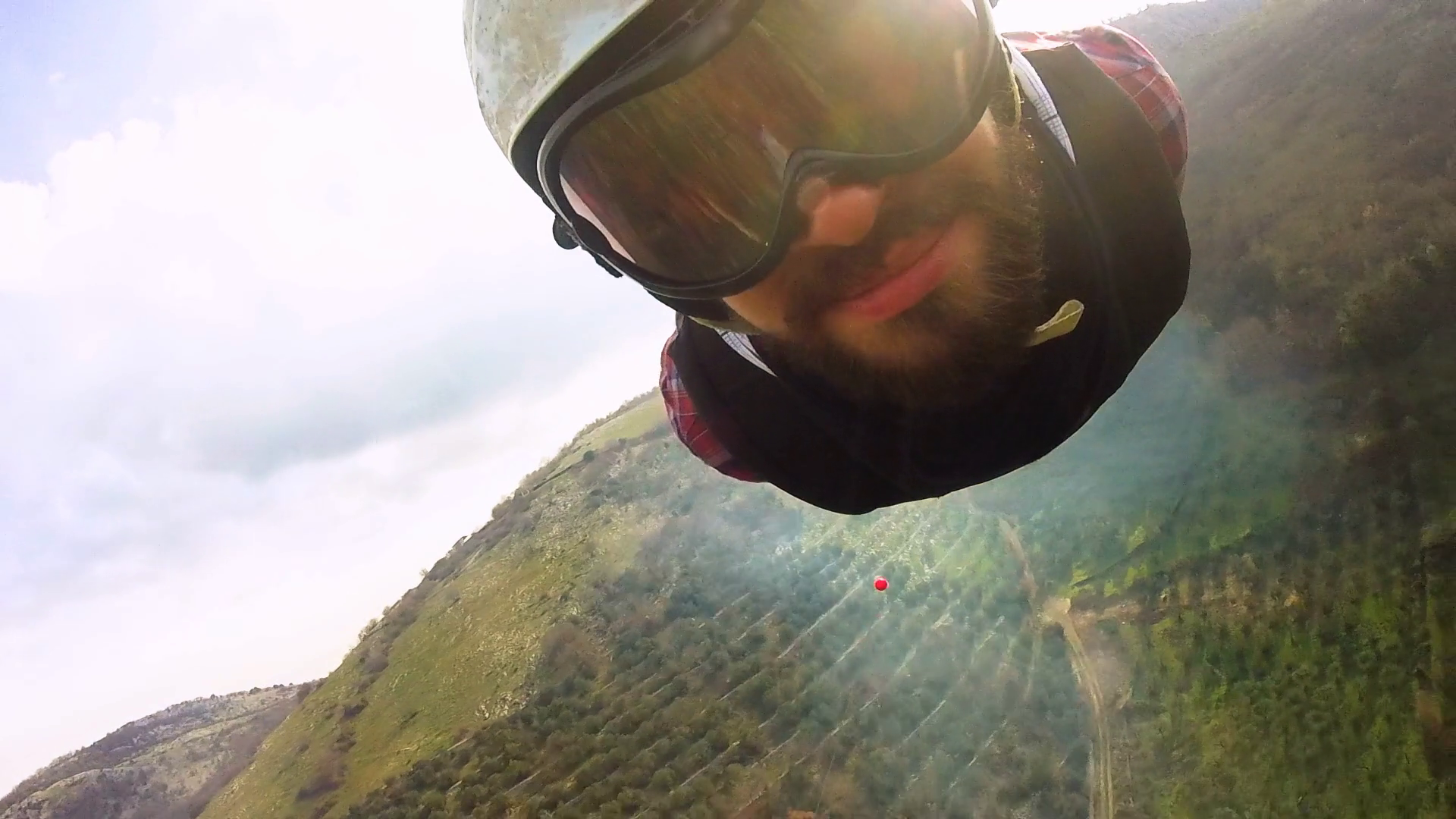 Young Tourist man sliding on zip line, cable mounted camera in front