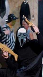 Halloween party, photo session, young people dressed up in scary costumes and made a horrific make-up.