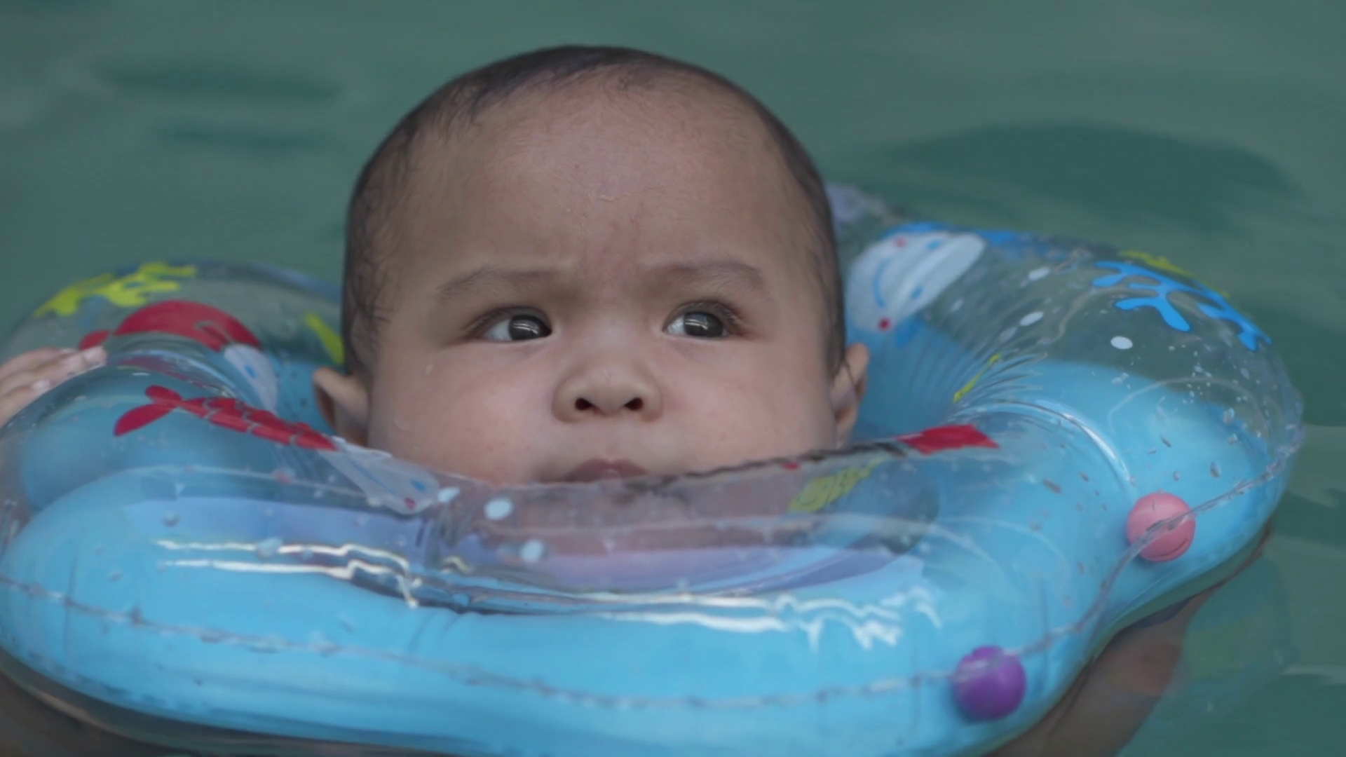 Little Asian Baby 1 Year Old Toddler Child Swimming Using Blue Pool Floater Learn to Swim Slow