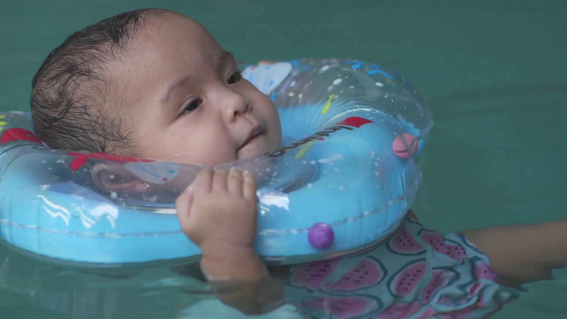 Little Asian Baby 1 Year Old Toddler Child Swimming Using Blue Pool Floater Learn to Swim Slow