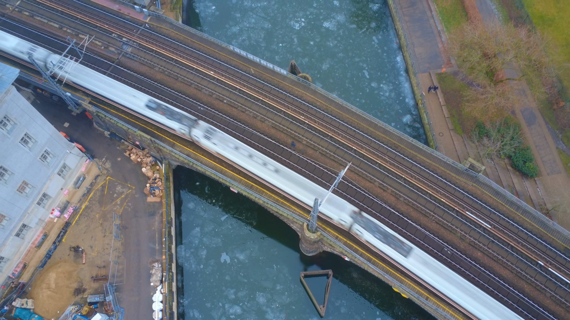 Train Crossing Bridge Over Frozen River Stock Footage SBV-353808003 ...