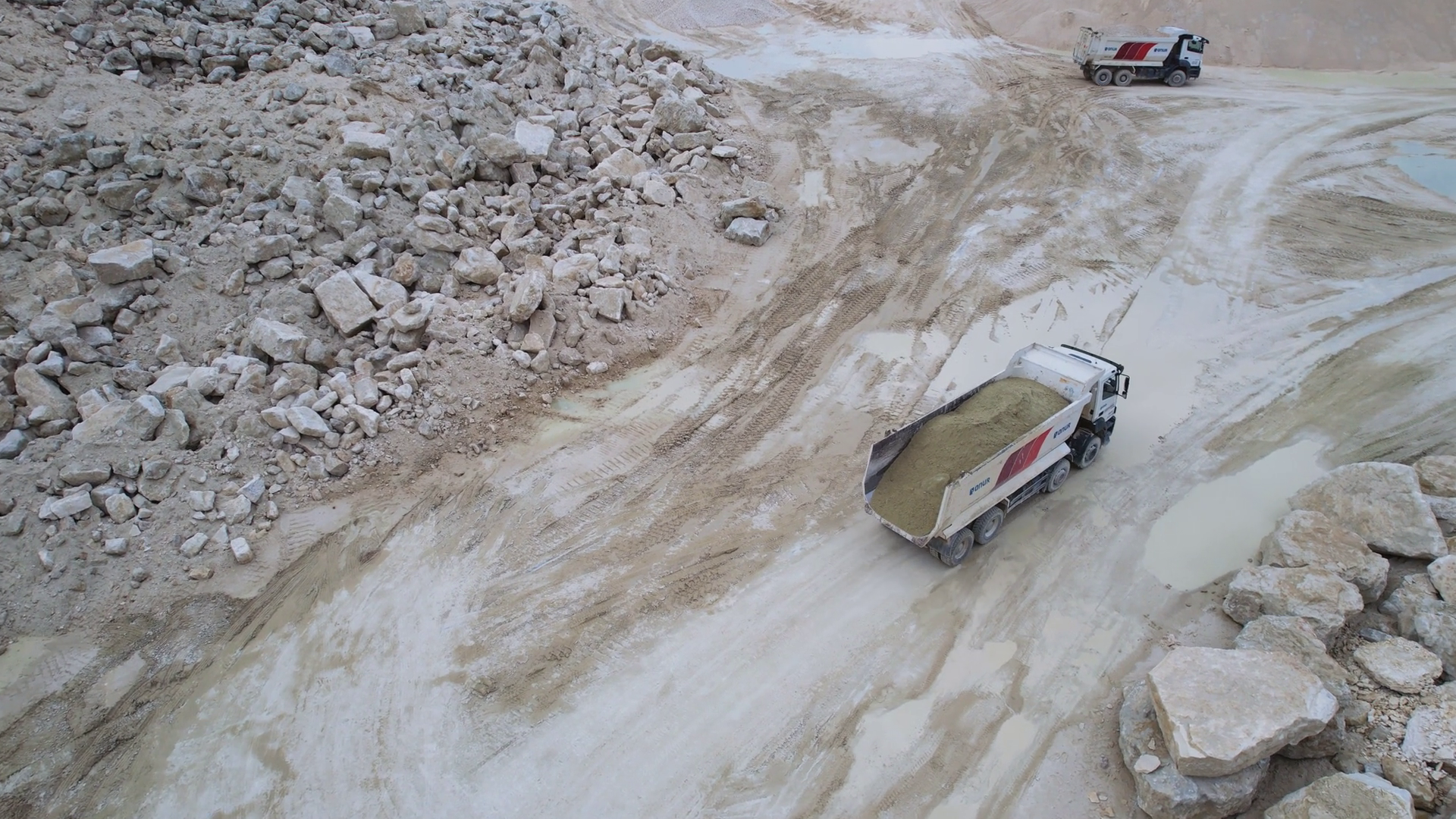 Drone Shooting Of Large Dump Trucks Driving Stock Footage SBV-352135298 ...