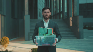 Depressed Caucasian executive departs, Business leader in somber mood says goodbye amidst cityscape backdrop