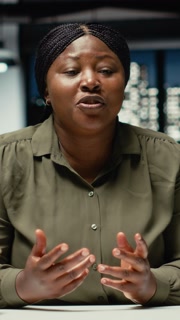 Vertical Video POV of businesswoman engaging in web video call with investors group, hosting online meeting for briefing and decision making