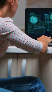 Vertical video Angry female hacker of failing closing laptop working from home at computer. Programmer writing a dangerous malware for cyber