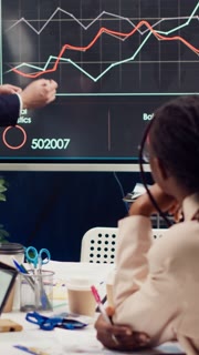 Skilled project team reviewing annual reports market trends in briefing meeting, knowing what to improve in order to guarantee customer