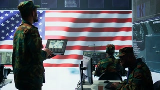 US soldiers operating in a high tech cybersecurity command post, managing state secrets and information. Protecting servers against digital