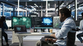 Data center engineer in wheelchair using AI requesting help from coworkers during security breach. Server farm worker with disability aided