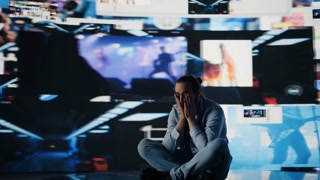 Paranoid guy suffers from emotional damage caused by obsessive social media use. Young man being overwhelmed by excessive information and