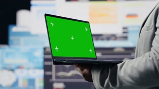 African american entrepreneur using copy display on device, reviewing big data insights on dashboard. Young adult showcasing strategic