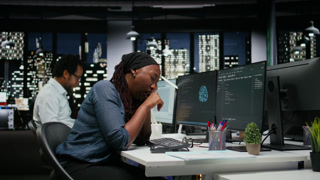 Tired programmer falling asleep in office while analyzing machine learning algorithms. Sleepy IT expert reviewing code logic to improve