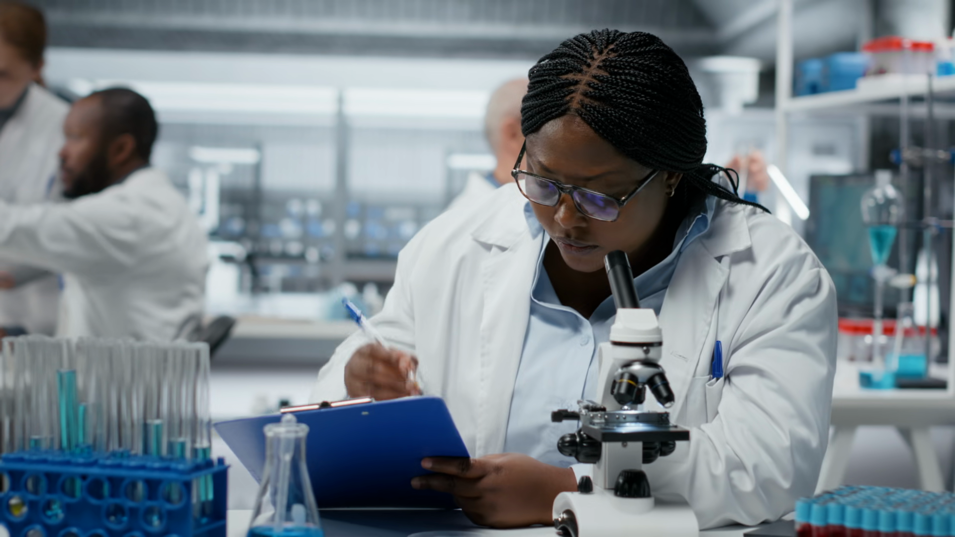 Female Scientist Using Optical Microscope To Stock Footage SBV ...