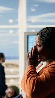 Vertical Video Emotional airport farewell with parents saying goodbye to teen daughter, child leaving to study abroad at university. Young