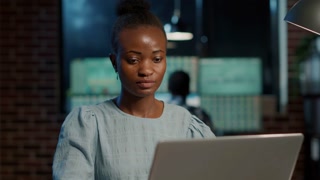 Sales consultant working on laptop to develop stock trade profit, using forex exchange statistics to obtain capital investment. Economy growth with market graphs and price numbers.