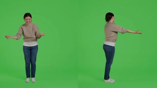 Lovely woman spreading love and positive vibes on greenscreen backdrop
