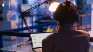 Executive manager looking at marketing statistics on pc, working after hours to create financial report for profit. Company employee planning business investment for corporate development.