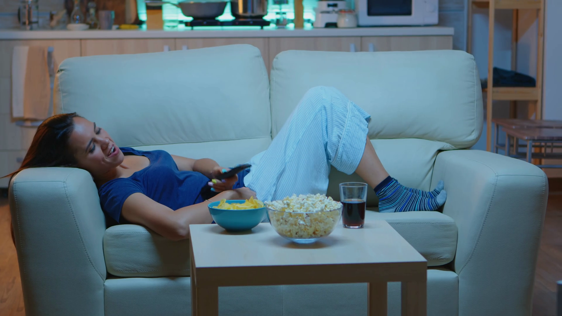 remote control lying on couch laughing