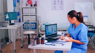 Assistant taking notes listening advice of remote doctor during video call, virtual health conference, training webinar concept. Medical physician talking diagnoses patients, online meeting