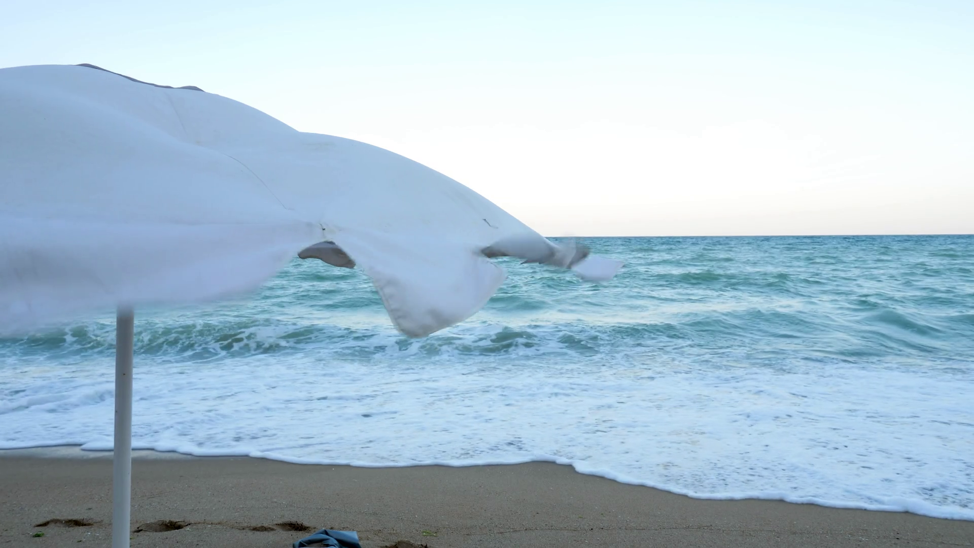 Beach Umbrella Blowing In Wind Near Sea Stock Footage SBV326582628