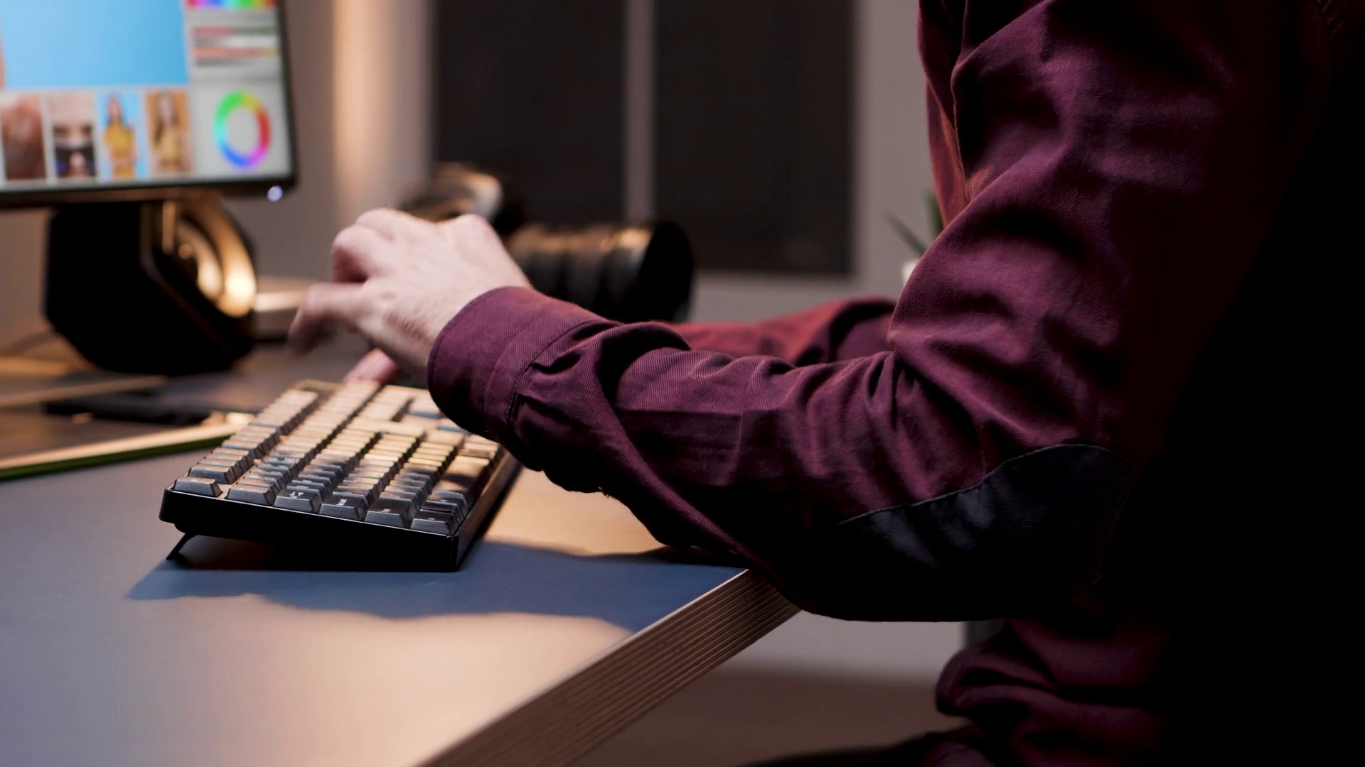 Closeup of young photographer using keyboard. Creative retouching