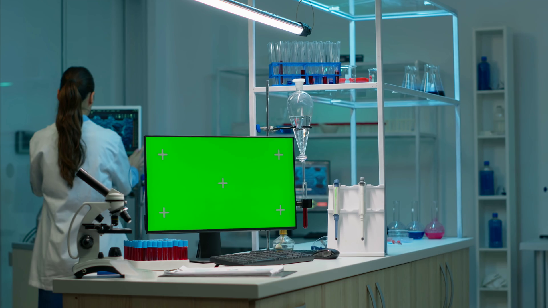Computer with green screen working in labooratory with mock up monitor