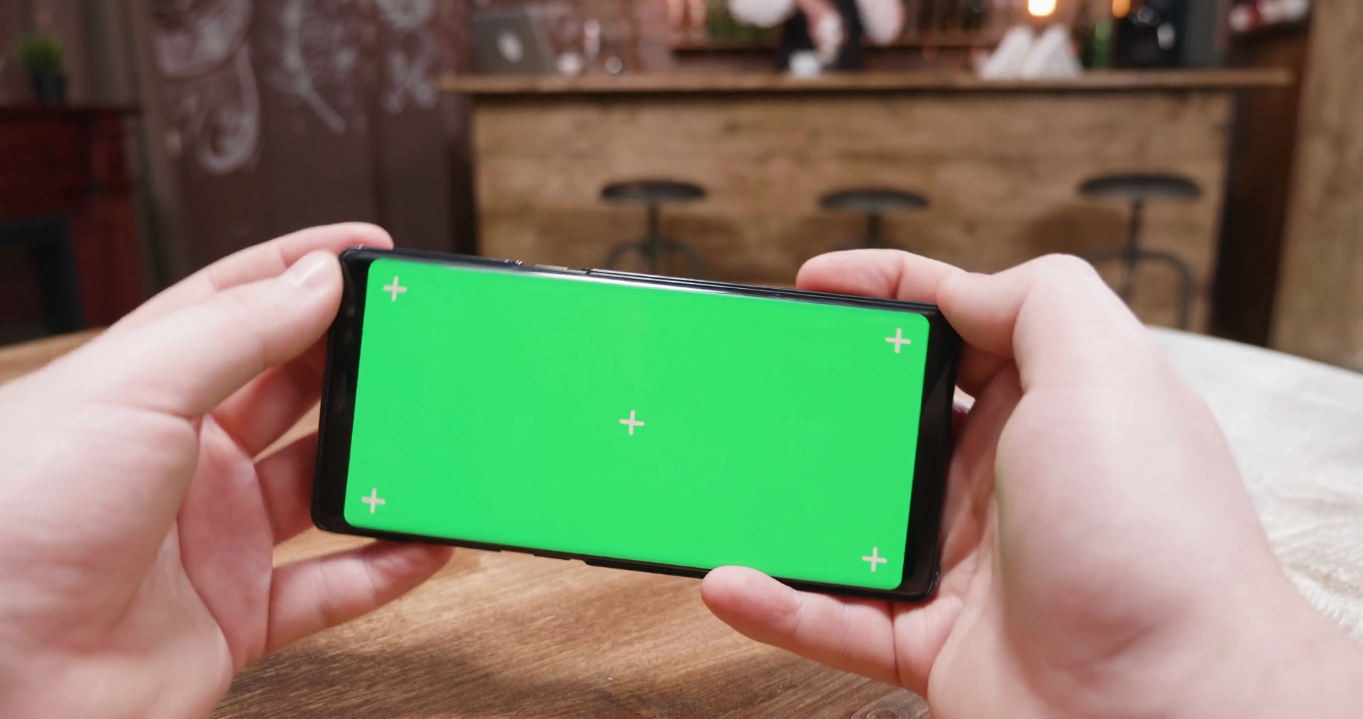 Handheld Shaky Footage Of Man Playing Video Games On Phone With Green 