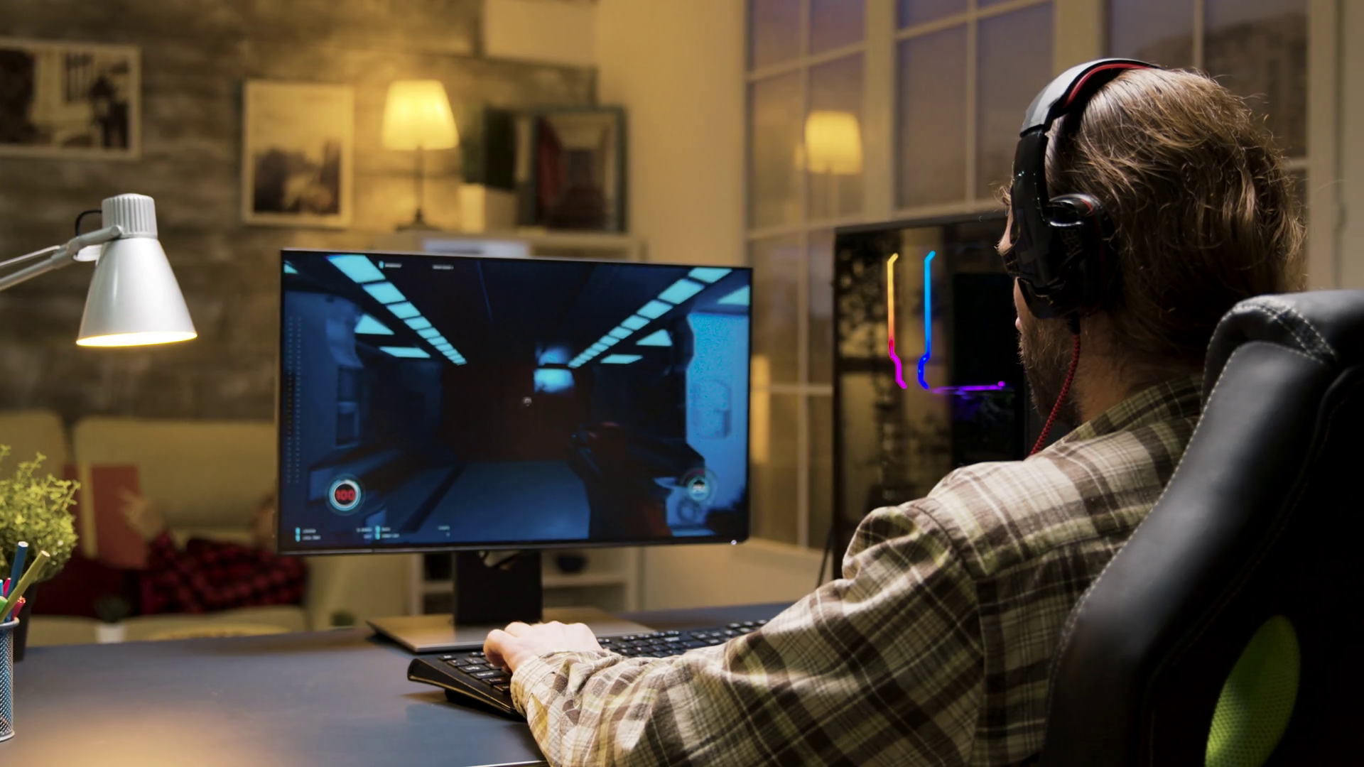 Male with headphones playing online video games talking with other