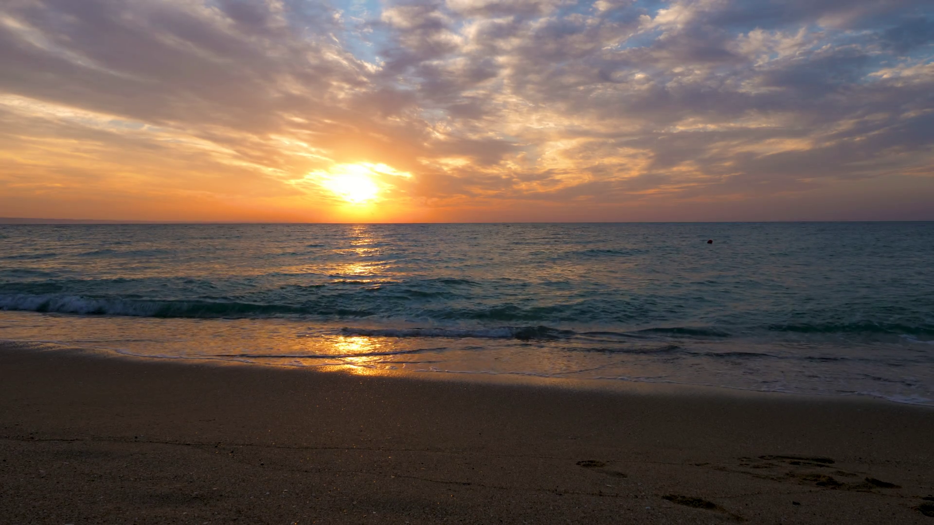 Scenic sunrise over the sea on the beach. Beautiful landscape. Travel