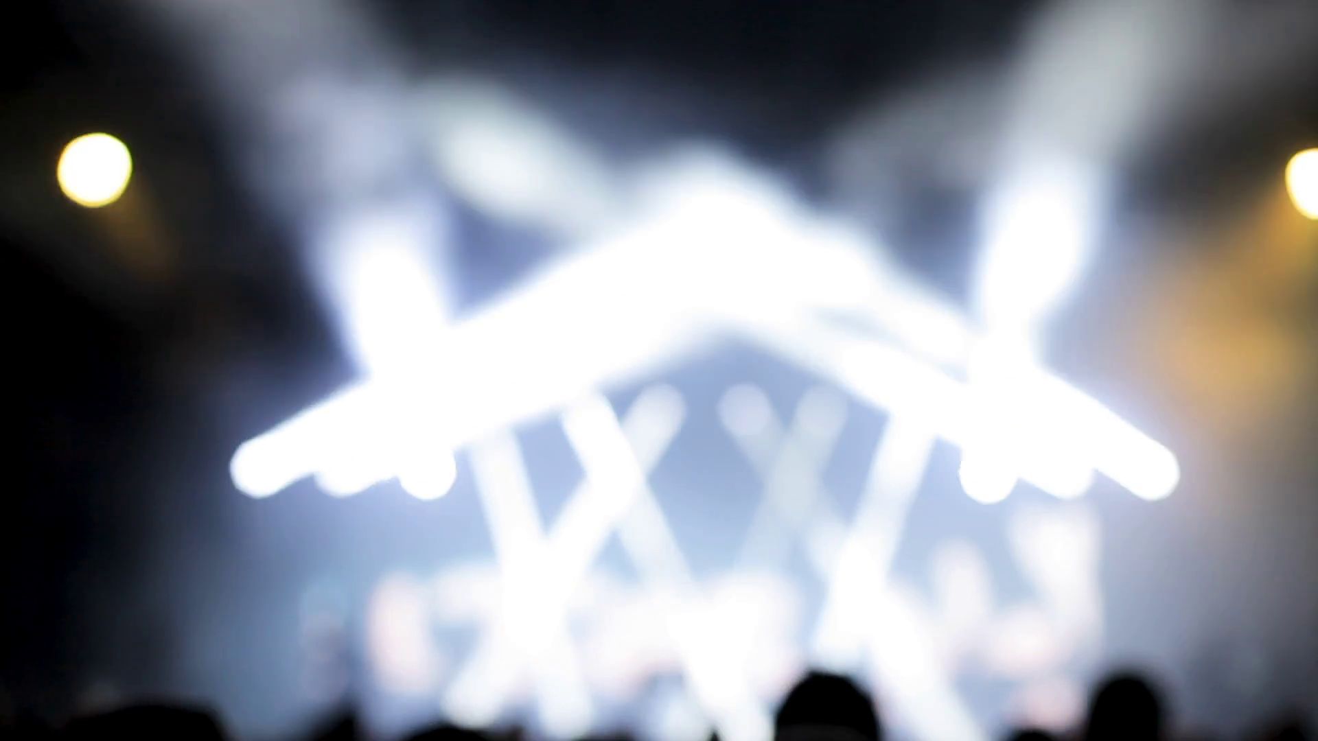 Strobing stage lighting at a music festival. Colored lights everywhere