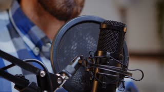 Using professional microphone for recording vlog in home studio. Creative online show On-air production internet broadcast host streaming live content, recording digital social media communication