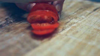 Smoke transformation effect of Sliced cherry tomatoes, Italian Salami sausage and mozzarella cheese in heart shapes on a wooden tray table as ingredients for pizza. Preparing heart shaped pizza for