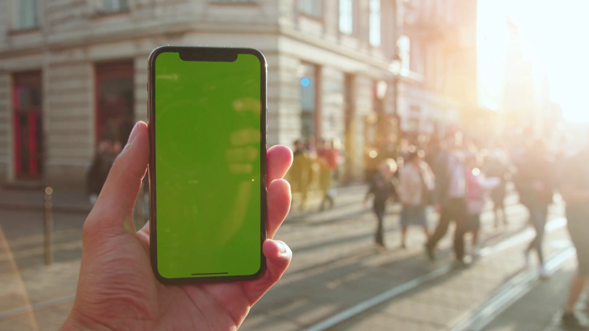 Male hand holding empty greenscreen vertical mockup