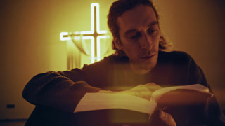 Focus on Faith: Close-Up Bible Reading by Cross Light