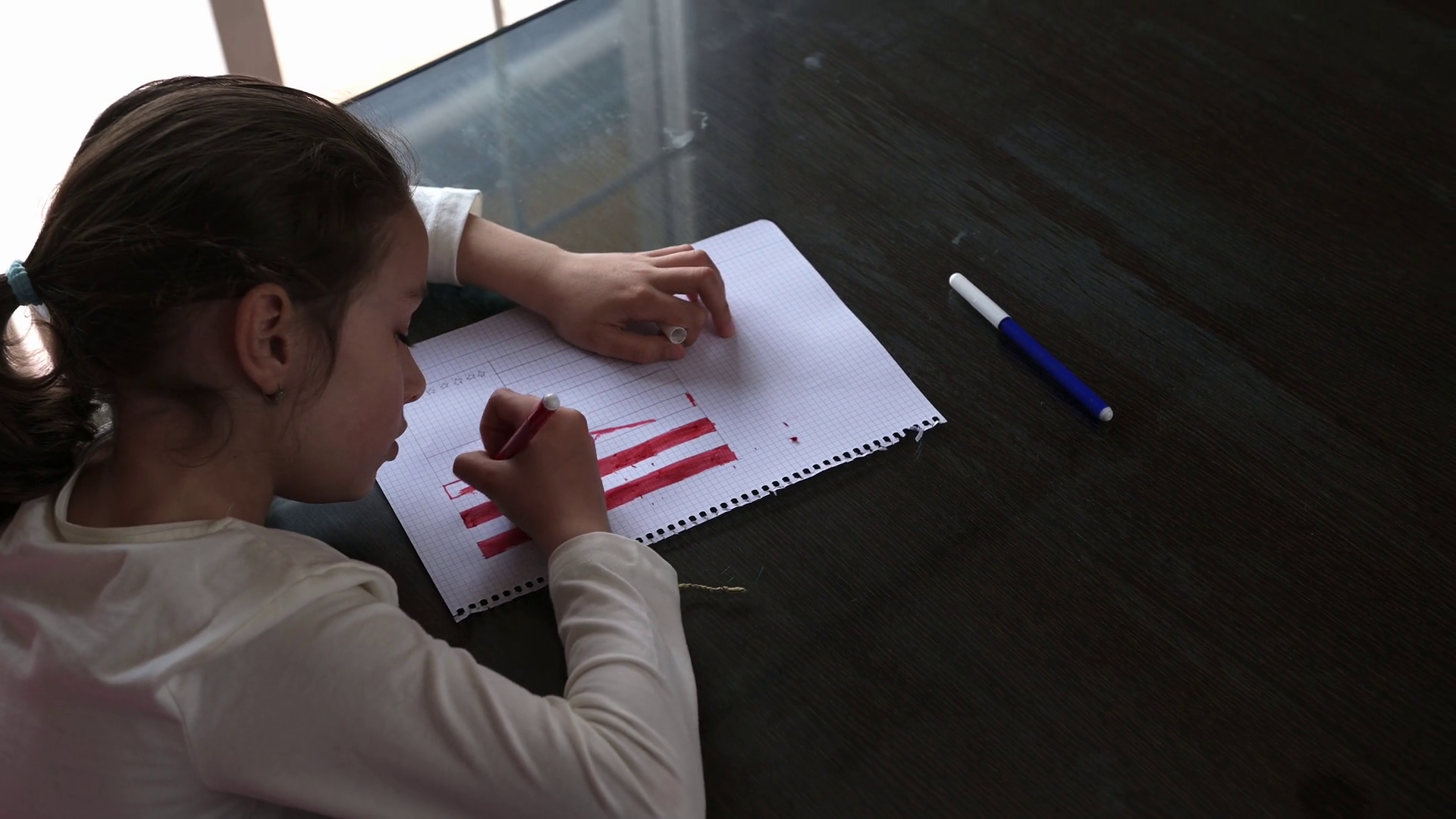 Young Girl Drawing On Graph Paper With Stock Footage SBV-352110000 ...